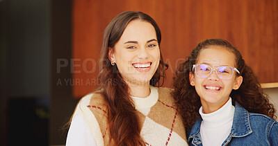 Buy stock photo Mother, daughter and smile for portrait in home with connection, love and care with glasses. Wellness, laugh and hug with woman and girl child in family house for safety, security or relax on weekend