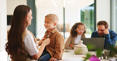 Buy stock photo Mom, boy and ready with shirt, family and smile with care, helping hand or getting dressed in home. People, parents and children with clothes, prepare and happy for bonding. love or support at house