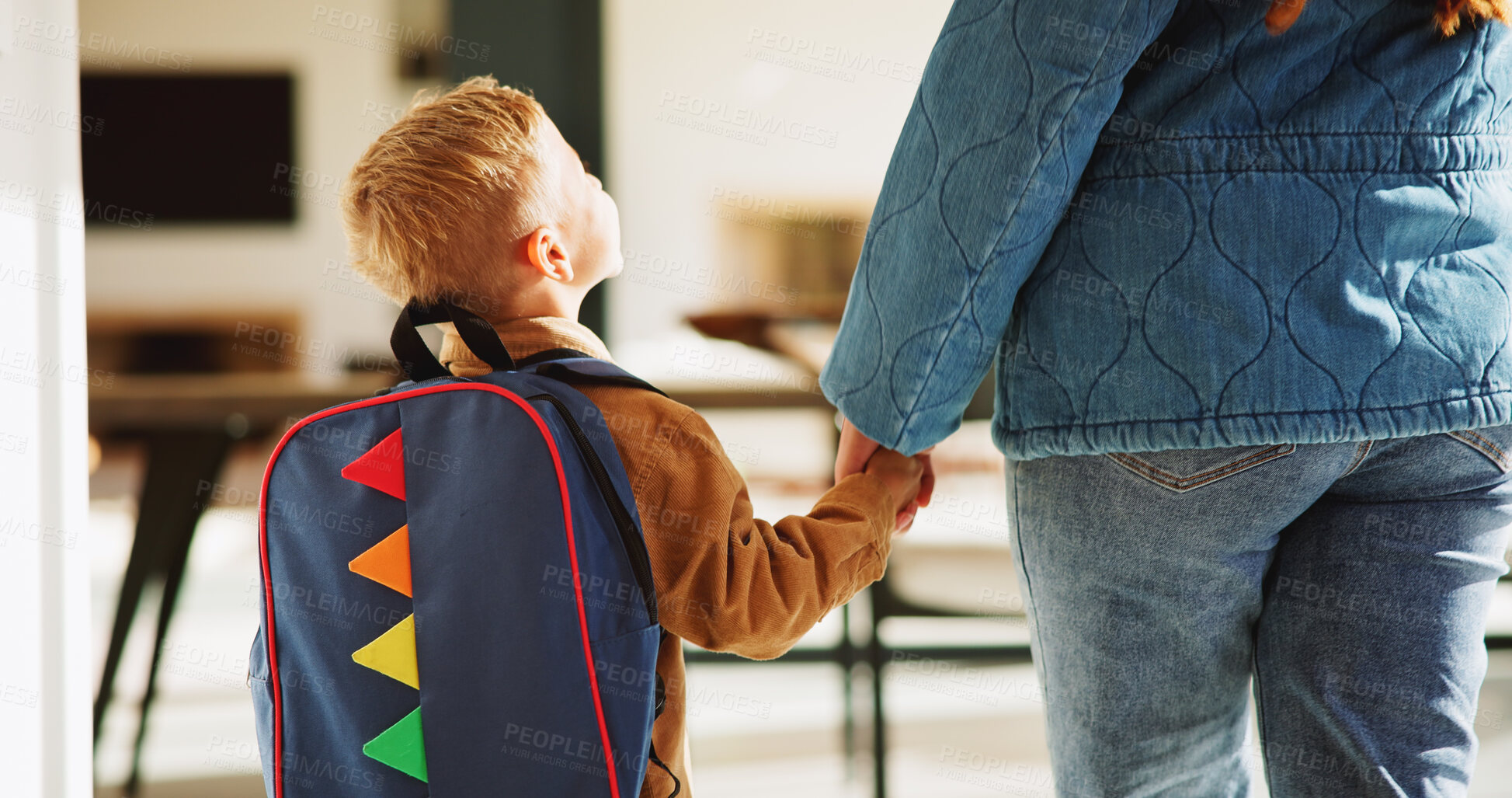 Buy stock photo Mother, child and holding hands in home with backpack, support or getting ready for preschool education. Back, mom and boy in lounge with bag, leaving and morning routine for learning at ECD academy.