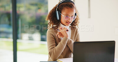 Buy stock photo Girl, laptop and headphones with online course in home with smile, glasses and attention for e learning. Child, happy and computer with virtual class, discussion and video with education at house