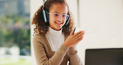 Buy stock photo Girl, laptop and headphones with e learning in home with smile, glasses and attention for online course. Child, happy and computer with virtual class, discussion and video with education at house
