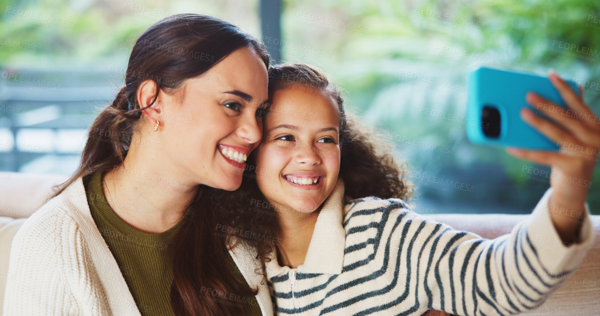 Buy stock photo Mother, child and happy in home for selfie, status update and bonding for relationship memory. Social media, mom and daughter in living room for photography, profile picture and care with connection