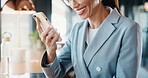 Businesswoman, texting and hand with phone in cafe, communication or reading message on social media. Restaurant, remote work and person with mobile for chat, online and smile for positive feedback