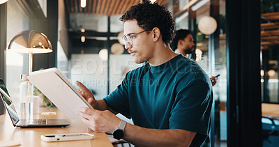 Buy stock photo Man, tablet and remote work in cafe with laptop, online research and check trends for graphic design. Freelancer, person and digital designer in restaurant with tech, editing project and campaign.