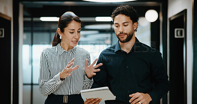 Buy stock photo Tablet, conversation and business people in hallway with project for finance review with budget plan. Meeting, discussion and financial advisors with digital tech for investment proposal in workplace