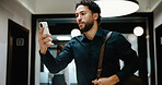 Reading, serious and businessman with phone in hallway, stock market news and review investment value. Mobile, planning exchange and trader with app to monitor assets, client message and office