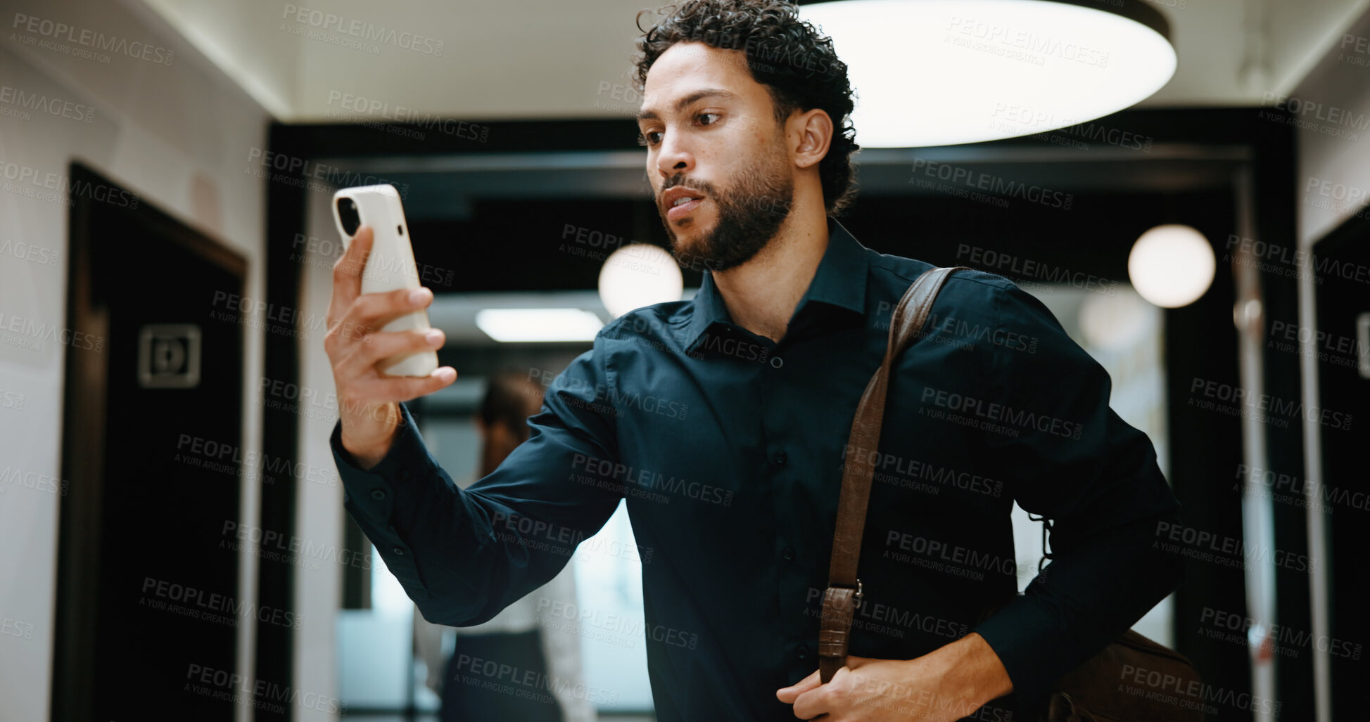 Buy stock photo Reading, serious and businessman with phone in hallway, stock market news and review investment value. Mobile, planning exchange and trader with app to monitor assets, client message and office