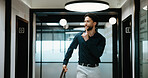 Business, man and quiet gesture in office for discreet departure, leave unnoticed and finish work early. Smile, male person and walking in hallway for silent exit, avoiding attention and sneaking out