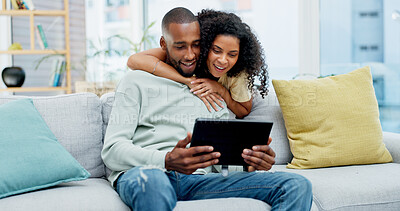 Buy stock photo Hug, couple and happy with tablet on sofa for streaming series, social media video and bonding. Love, african people and smile with tech in home for reading online post, relationship or weekend break