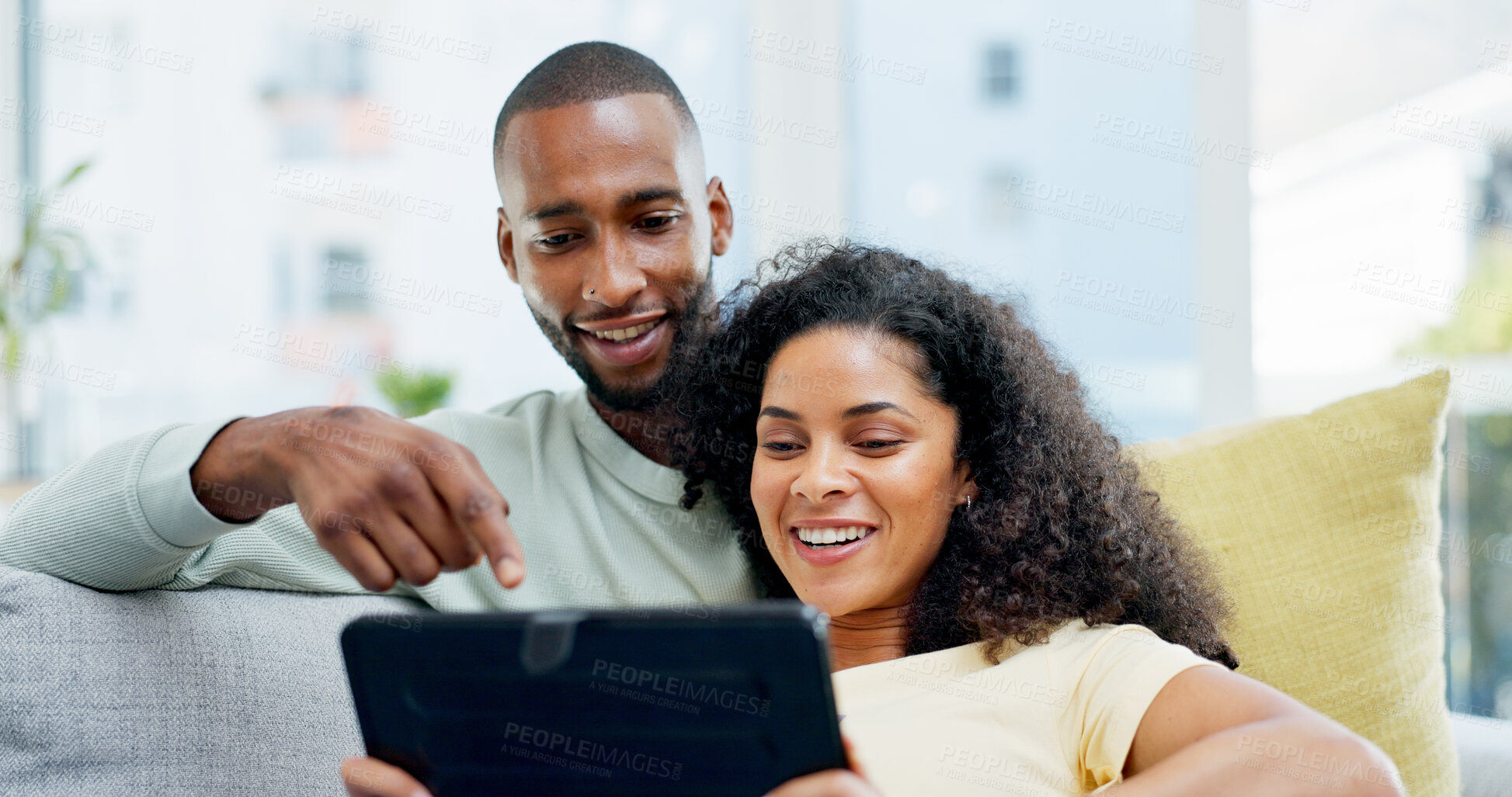 Buy stock photo Relax, couple and happy with tablet on sofa for streaming series, internet show and connection. Support, african people and smile with tech in home for watching online film, bonding and weekend break