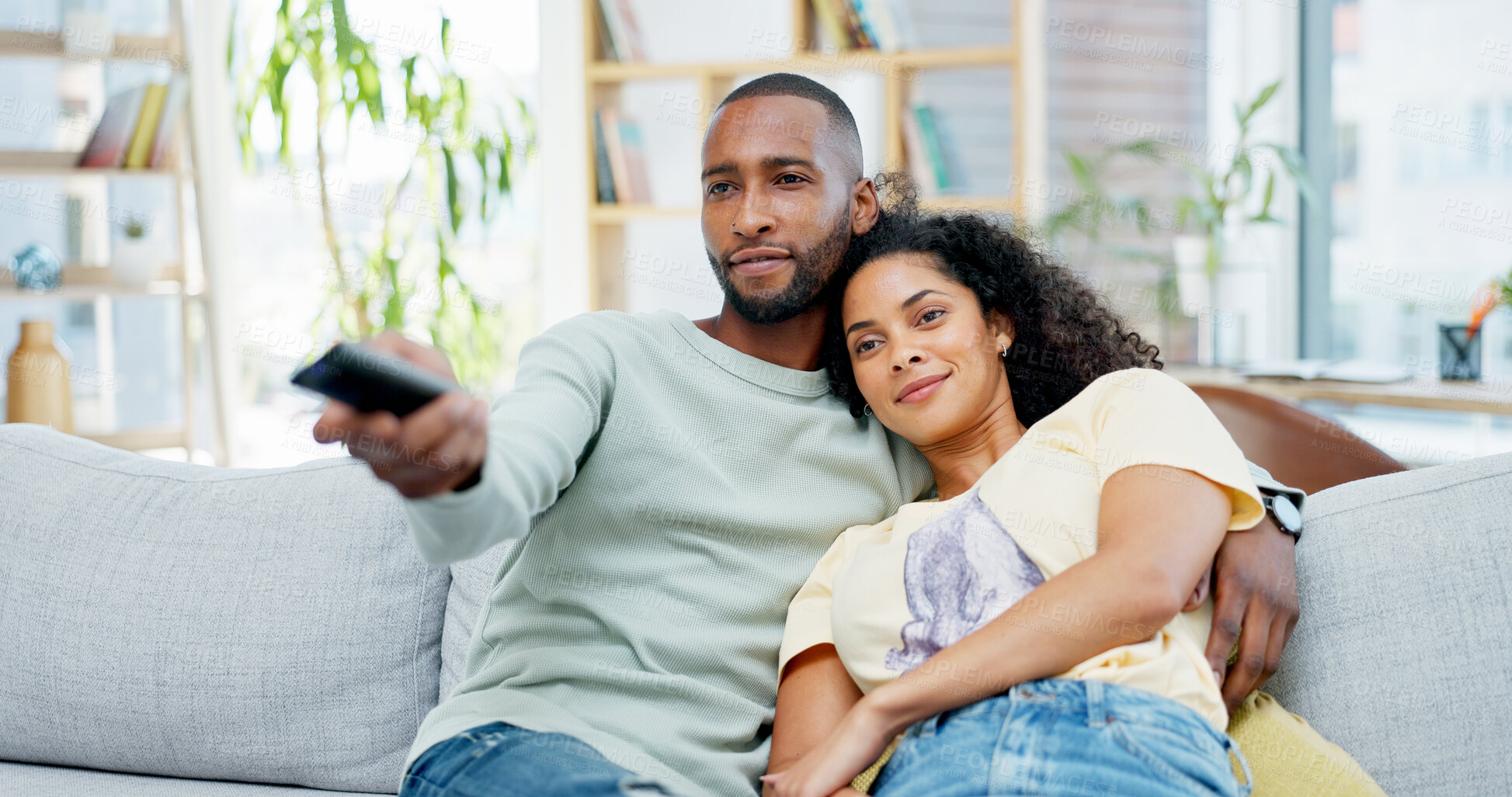 Buy stock photo Relax, home and couple watching tv on sofa with remote control for film, movie and weekend. Love, comfort and happy people in lounge with television, show and entertainment for bonding or holiday
