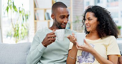 Buy stock photo Couple, happy and coffee on sofa with talk, story and memory with bonding in living room. African people, discussion and drink with smile, conversation and connection with relationship at apartment