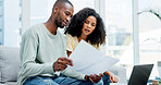 Document, laptop and couple on sofa for planning budget, savings or loan application at home. Online, review and people with paperwork for tax, bills or investment together for mortgage or insurance