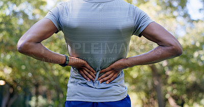 Buy stock photo Outdoor, hands and runner with back pain for fitness, poor posture and overworked muscle for sprain. Park, sports injury and person with backache from exercise burnout, spine tension and discomfort