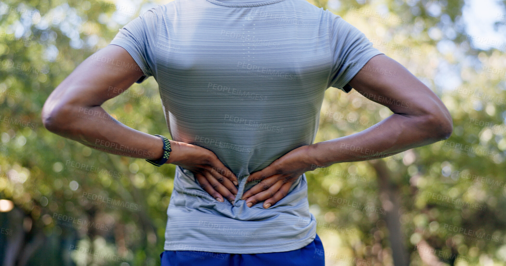 Buy stock photo Outdoor, hands and runner with back pain for fitness, poor posture and overworked muscle for sprain. Park, sports injury and person with backache from exercise burnout, spine tension and discomfort