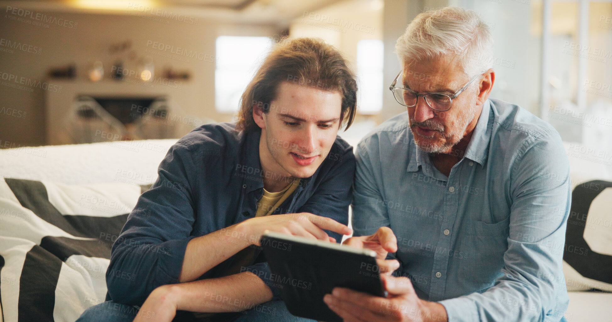 Buy stock photo Old man, learning and son with tablet in lounge, skill development and listening to app explanation. Teaching, senior father and pointing at website, digital literacy and people with tech in house
