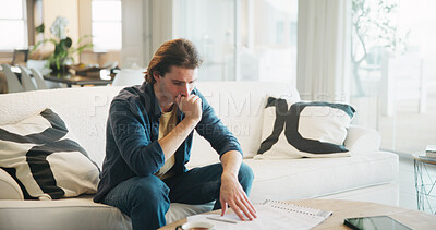 Buy stock photo Stress, paperwork and man on sofa with bills, financial or thinking of investment decision in home. Reading, documents or person with doubt, mistake or confused for mortgage letter, insurance or debt