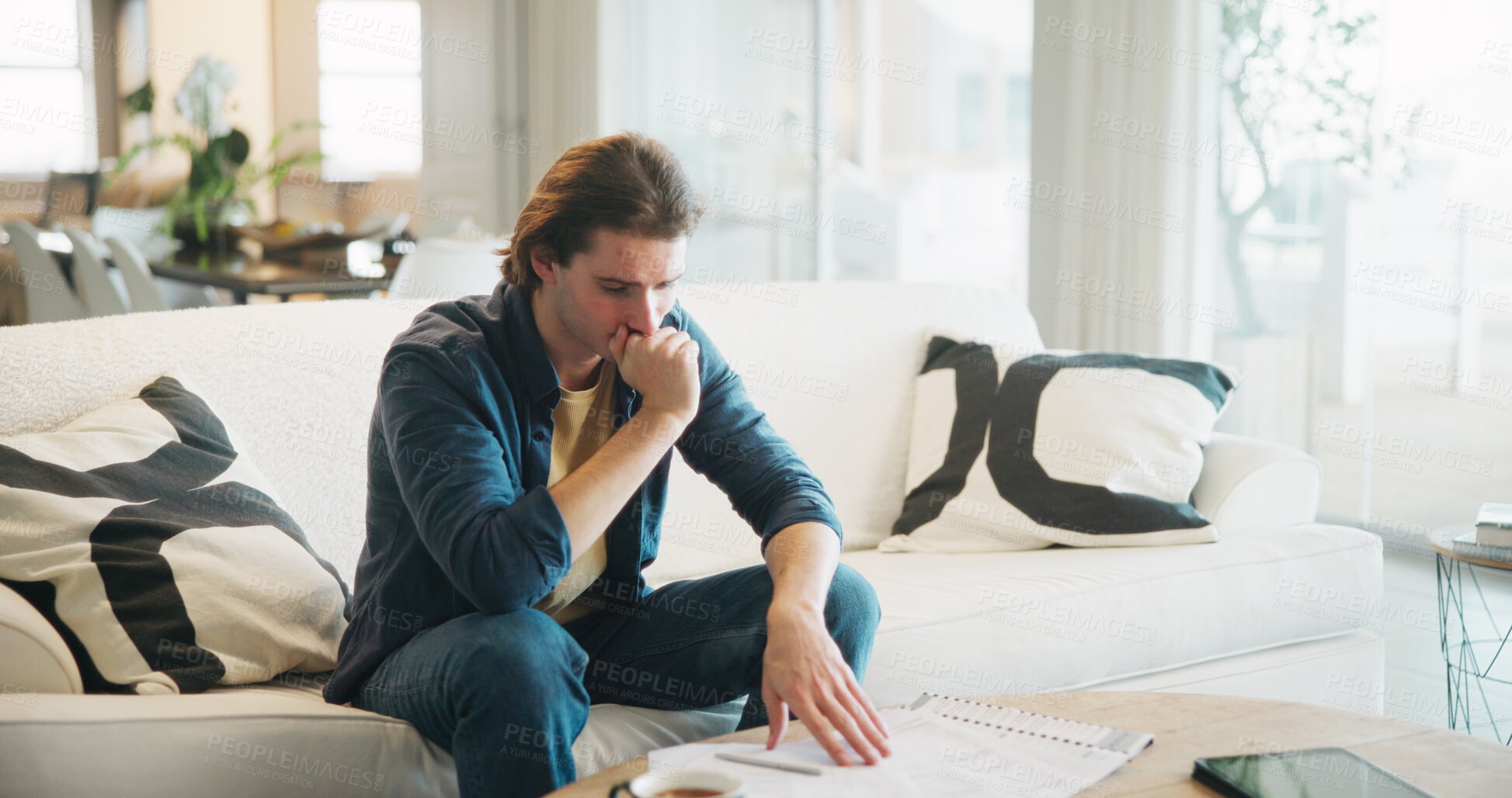 Buy stock photo Stress, paperwork and man on sofa with bills, financial or thinking of investment decision in home. Reading, documents or person with doubt, mistake or confused for mortgage letter, insurance or debt