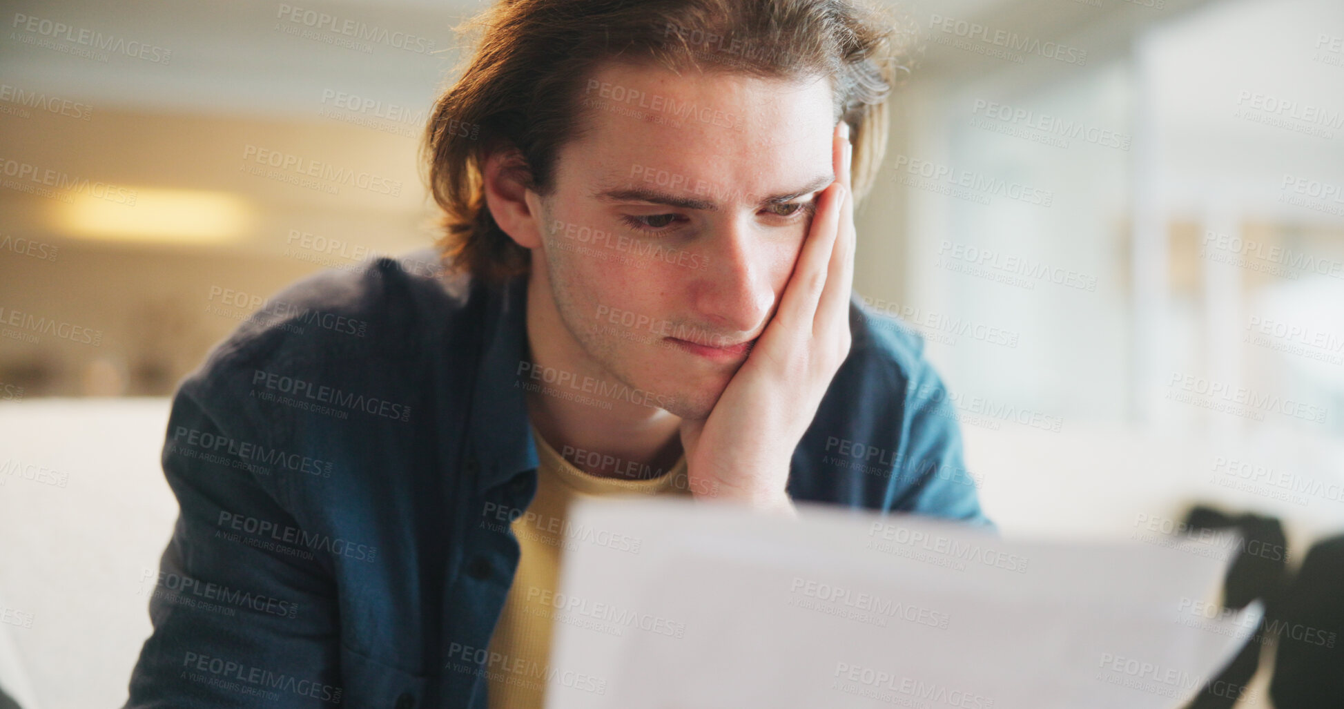 Buy stock photo Paperwork, debt and man in home with stress for financial challenge, bankruptcy or rent increase. Document, expenses and person at house with crisis for loan, bad credit or reading info for bills