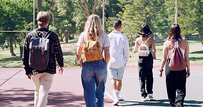 Buy stock photo Back, friends and students walking on campus of college or university commute together. Backpack, education and travel with group of people outdoor for development, learning or trip to school