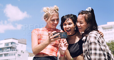 Buy stock photo Friends, phone and women in city with excited, cool and happy conversation for weekend. Wow, laugh and group with social media post, internet or meme in town for summer hangout, vacation or holiday