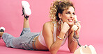 Smile, telephone and woman with fashion in studio for phone call, communication or retro outfit. Happy, chat and person with landline for gossip conversation with vintage style by pink background.