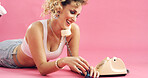 Fashion, telephone and woman with nail polish in studio for phone call, communication or retro outfit. Happy, space and person with landline for conversation with vintage style by pink background.