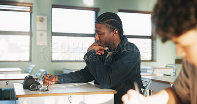 Buy stock photo Student, thinking or writing in classroom with college assignment, education or english essay idea. Man, notes or learning in university with problem solving, language assessment or skill development