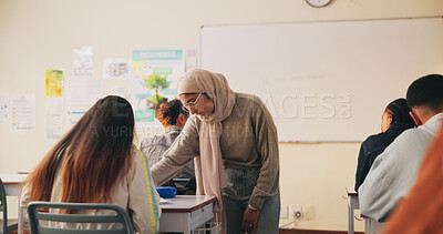 Buy stock photo Teacher, classroom and woman with student for help, support or exam results in science subject. Knowledge, education and educator with teaching lesson, study advice or guidance for learning in school