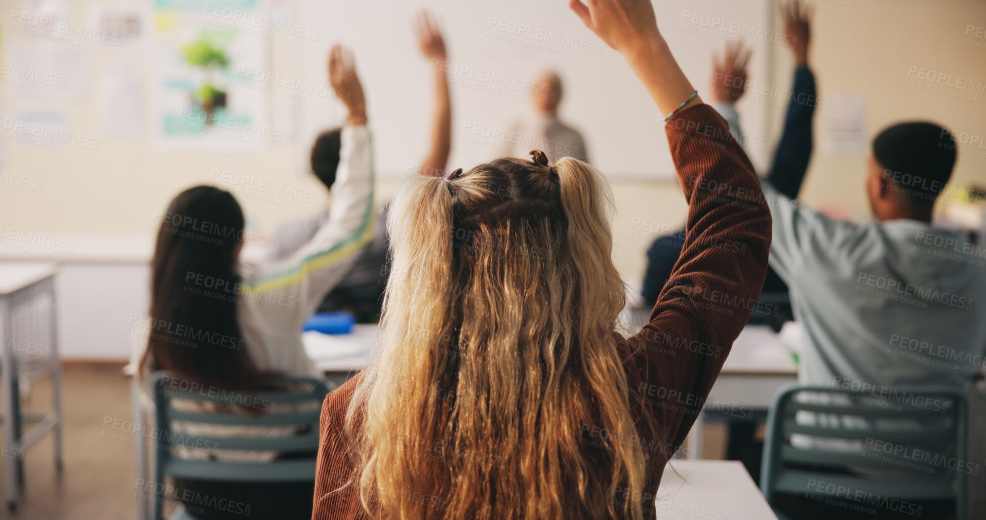 Buy stock photo Students, woman and question in college with raised hand, learning skills or participation for lecture. Back, person and query in university class with course assessment, knowledge quiz or education.