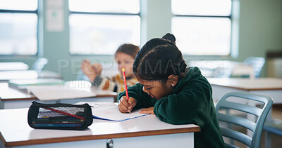 Buy stock photo Writing, assessment and quiz with girl in classroom for test, child development and knowledge. Education, notebook and lesson with student on school campus for learning, curriculum and study course