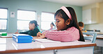 Writing, assessment and exam with kids in classroom for test, child development and knowledge. Education, notebook and lesson with students on school campus for learning, curriculum and study course