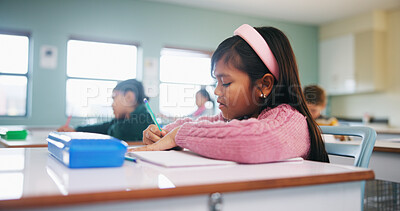 Buy stock photo Writing, assessment and exam with kids in classroom for test, child development and knowledge. Education, notebook and lesson with students on school campus for learning, curriculum and study course