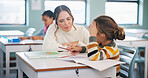 Teacher, student and child with help in classroom, task assistance and advice for academic development. Learning, educator and boy with syllabus support for knowledge, education or teaching in school