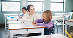 Teacher, students or girl with help in classroom, task assistance or advice for academic development. Learning, educator or child with syllabus support for knowledge, education or writing in notebook