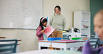 Child, school and reading book in classroom for learning, language development and teacher help. Storytelling, speaking and girl student with woman for support, presentation and literacy education