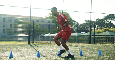 Buy stock photo Field, soccer and man with cone for sports, game practice and running drills for training. Football player, person and equipment outdoor for exercise, fitness challenge and agile coordination