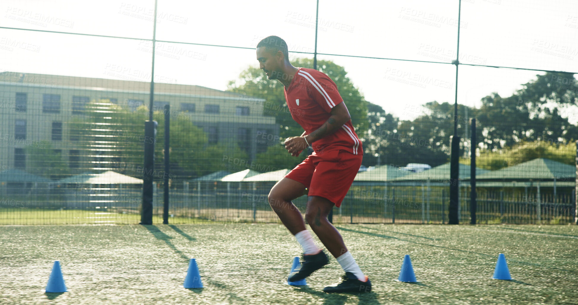Buy stock photo Field, soccer and man with cone for sports, game practice and running drills for training. Football player, person and equipment outdoor for exercise, fitness challenge and agile coordination