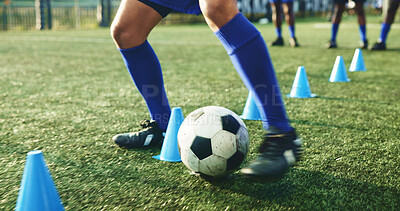 Buy stock photo Legs, soccer and person with cone for exercise, game practice or running drills for training. Football player, feet and man with equipment on field for agile fitness, sports challenge or ball control