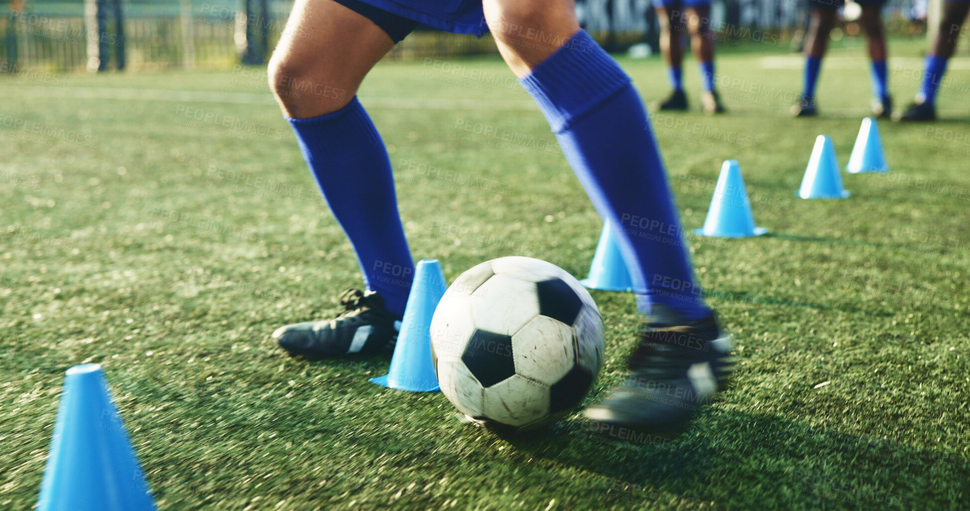 Buy stock photo Legs, soccer and person with cone for exercise, game practice or running drills for training. Football player, feet and man with equipment on field for agile fitness, sports challenge or ball control