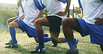 Legs, soccer and stretching with men outdoor on field together for game or match start. Fitness, sports and warm up with team of football players on grass pitch for competition or preparation