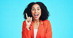 Woman, surprise and portrait with idea in studio for business solution on a blue background. Excited, female person or shock with smile, alert or answer for good news, notification or eureka on space