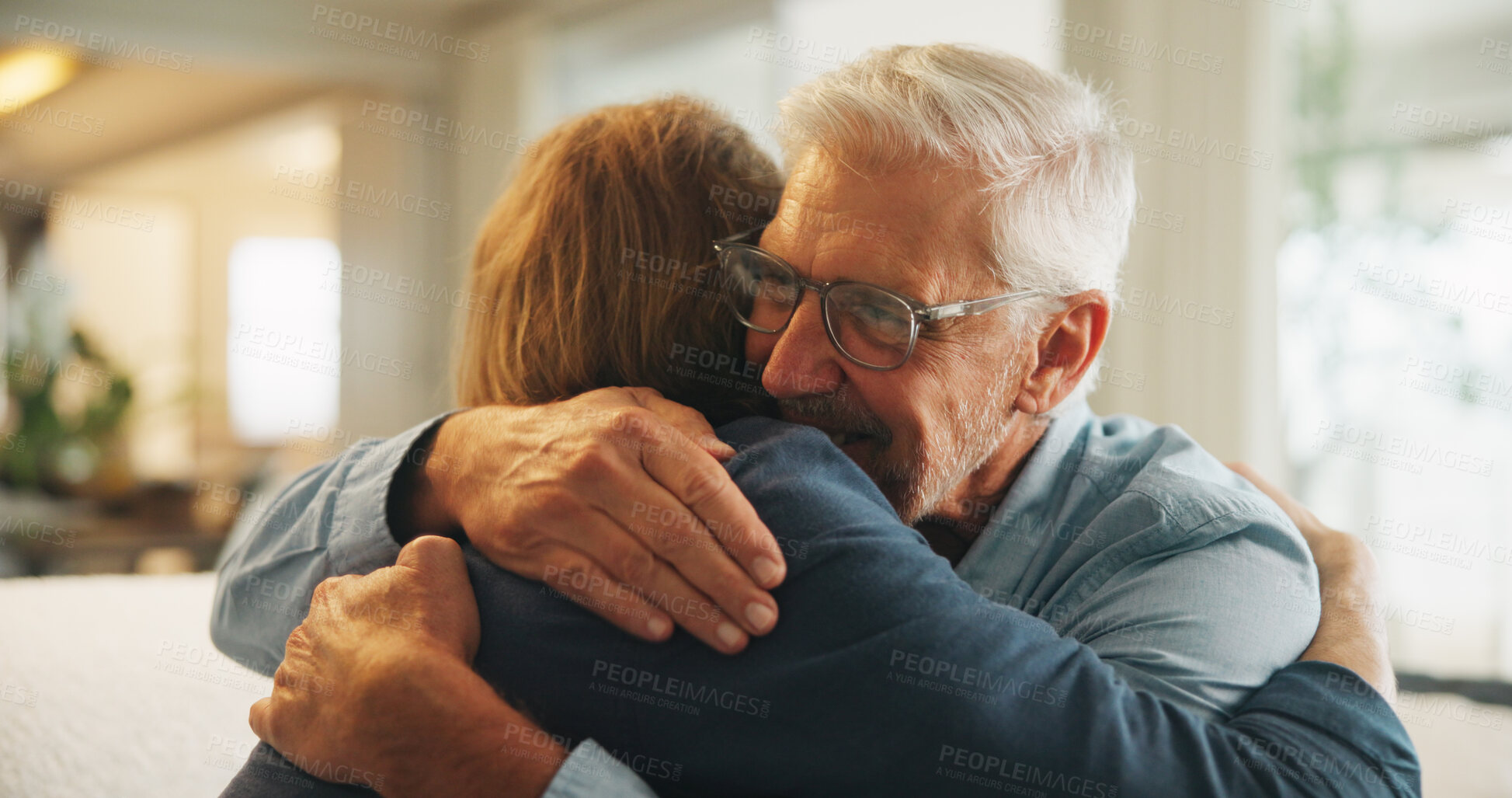 Buy stock photo Happy, hug and man with senior father in home for support, bonding and congratulations on good news. Smile, love and male person embracing elderly dad for comfort, care and family connection in house