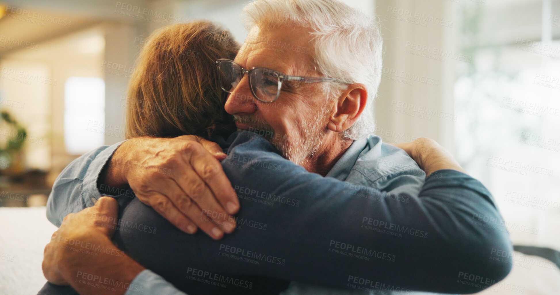 Buy stock photo Smile, hug and man with senior father in home for support, bonding and congratulations on good news. Happy, love and male person embracing elderly dad for comfort, care and family connection in house
