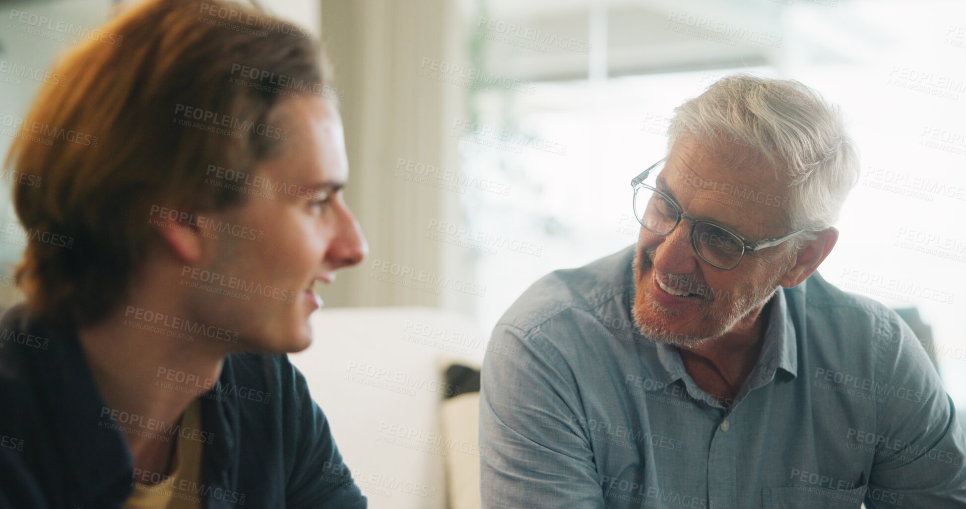 Buy stock photo Love, home and elderly father with man for conversation, connection and bonding together on weekend. Senior dad, son or talking on sofa with parent for advice, smile and support in living room