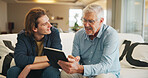 Happy man, home and senior dad with tablet, learning and laughing at funny video on social media app. Teaching, elderly father and people with smile on couch, digital literacy and family with tech