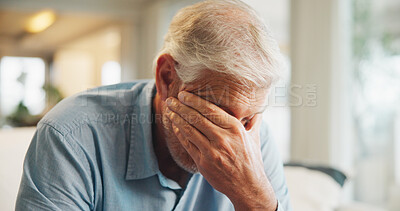 Buy stock photo Upset, crying and senior man in home on weekend with loneliness, grief or mourning in living room. Emotion, sad and elderly male person with depression for nostalgia, loss or bad news in house.