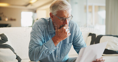 Buy stock photo Reading, paperwork and old man with stress, thinking or confused for insurance or bills in home. Policy, pension documents and senior person on sofa with worry or decision for financial report