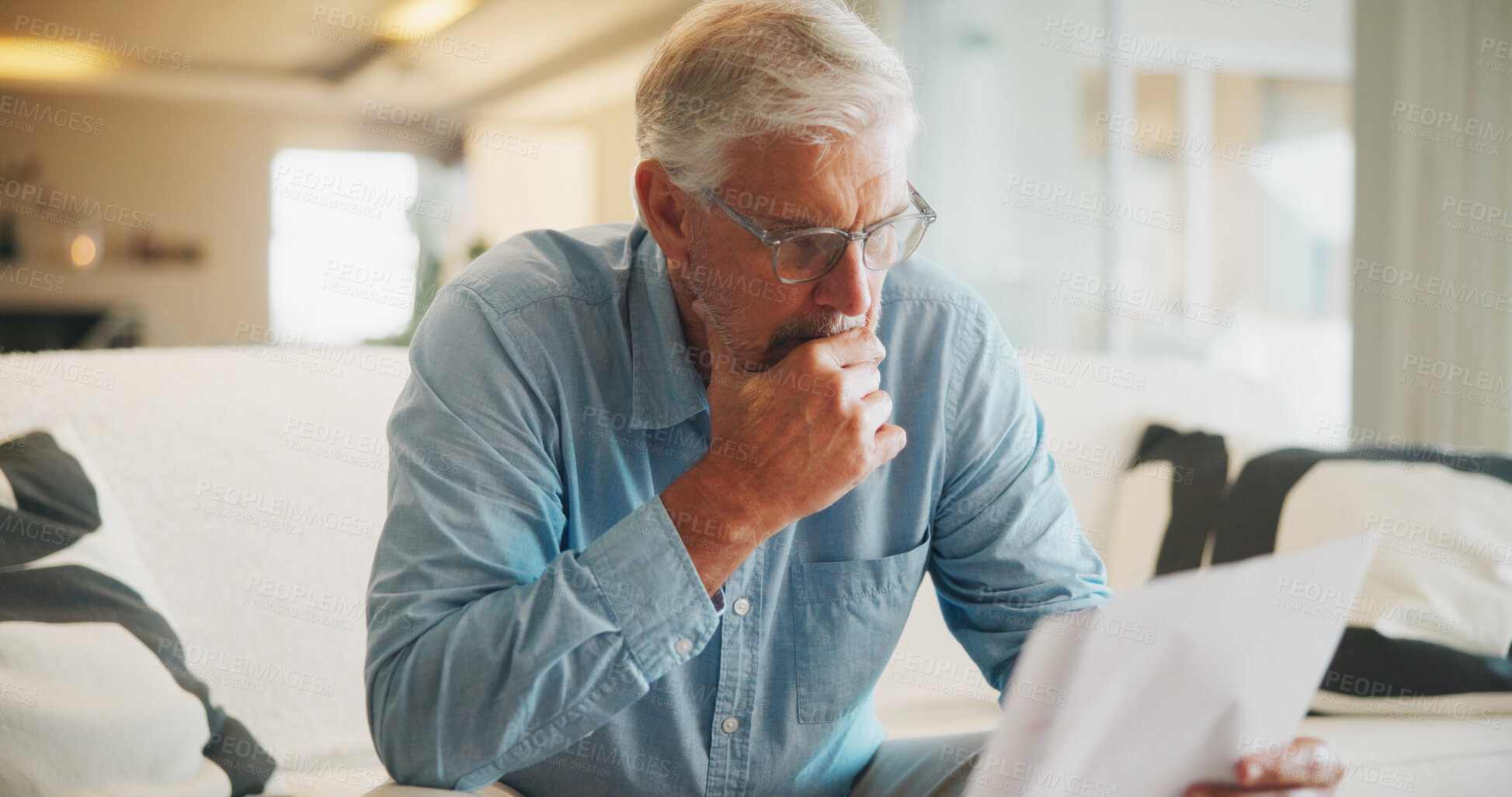Buy stock photo Reading, paperwork and old man with stress, thinking or confused for insurance or bills in home. Policy, pension documents and senior person on sofa with worry or decision for financial report