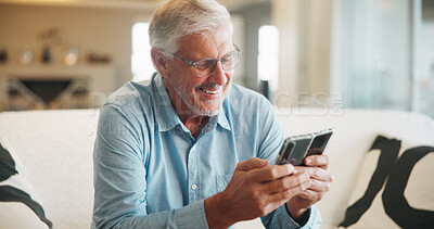 Buy stock photo Smile, phone and elderly man on sofa with media, retirement wellness and new memory aid app. Senior person, mobile and happy in home for innovative software, connectivity and relax with networking